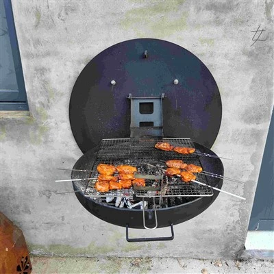 Sort vægmonteret grill